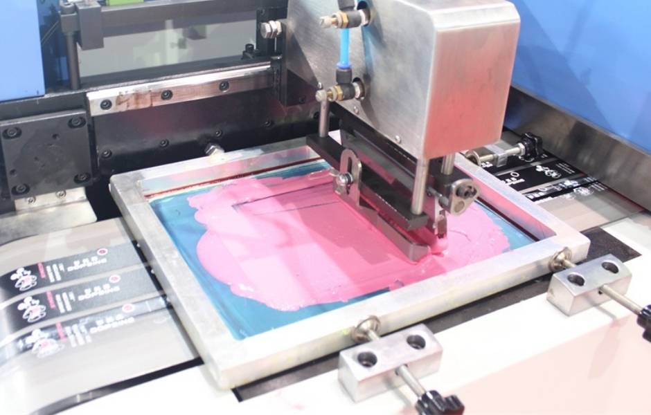 The machine is printing patterns on the banner.