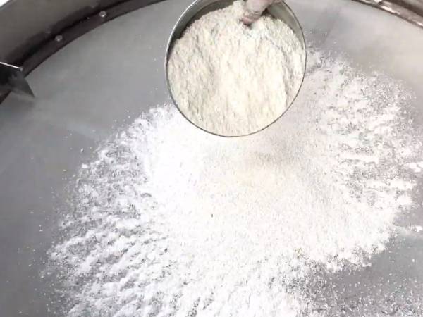 Ceramic powders is placed on the sieve screen for sieving