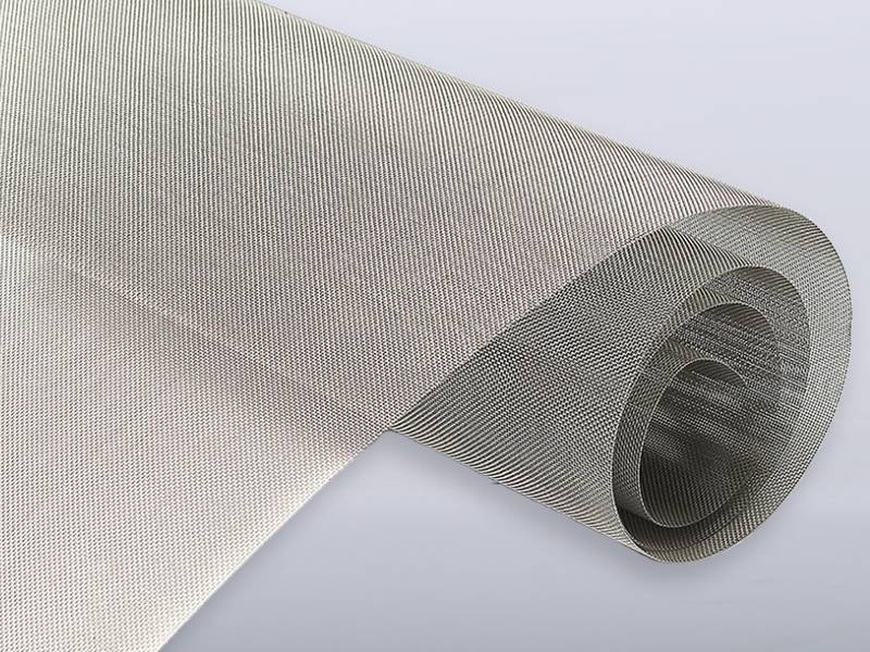 A roll of plain weave square weave wire cloth on white background.