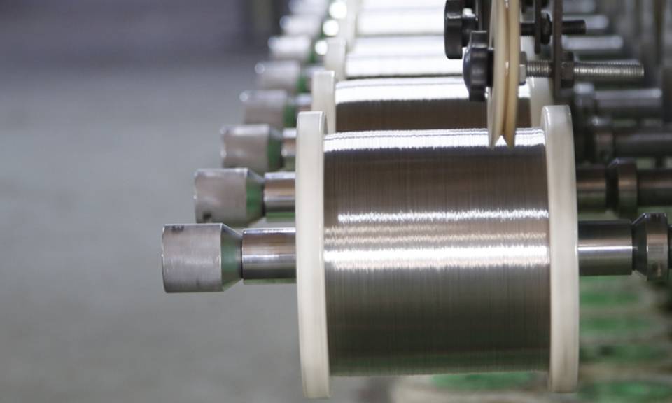 The machine is drawing stainless steel wires into desired sizes.